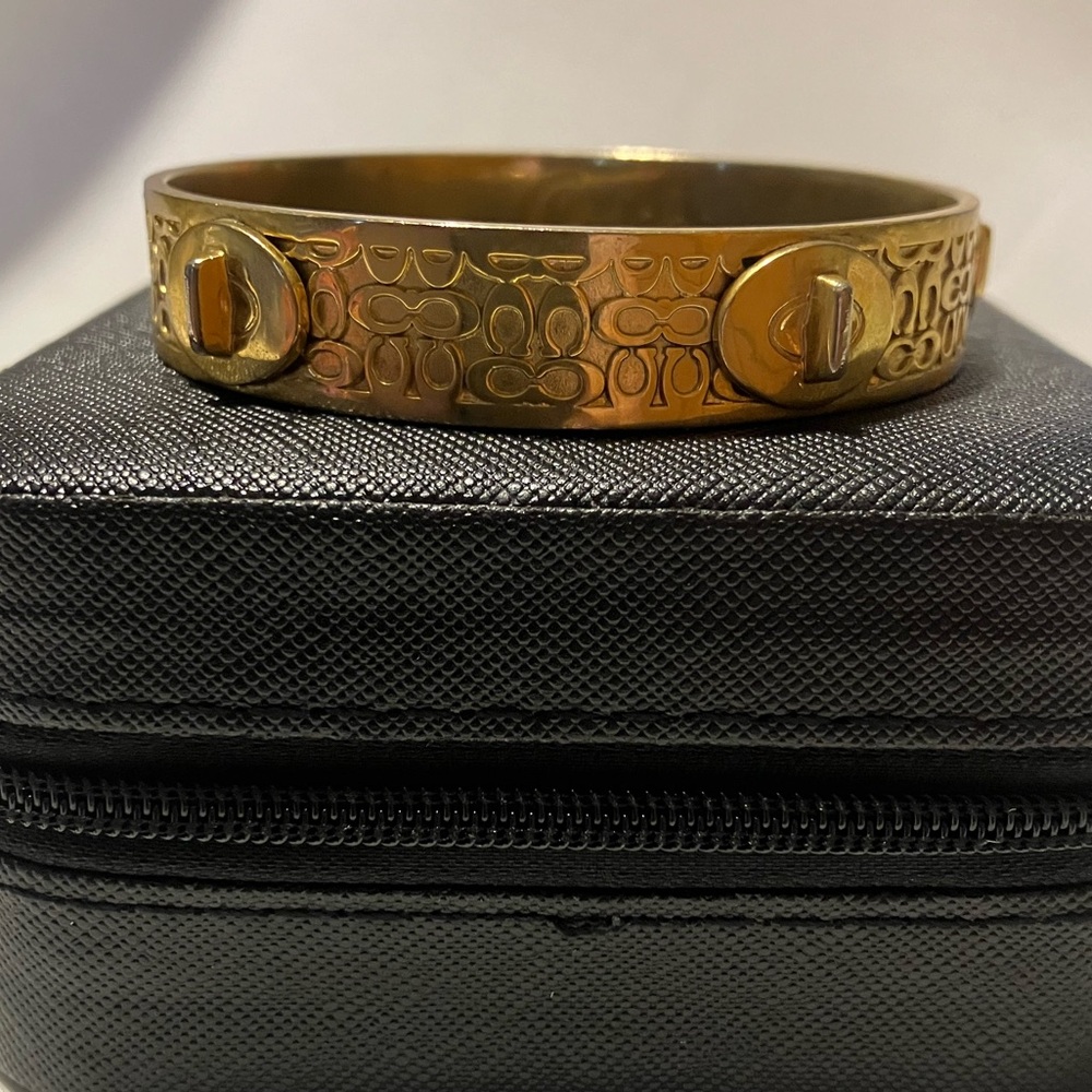 Coach Gold-Tone Signature C Embossed Bangle